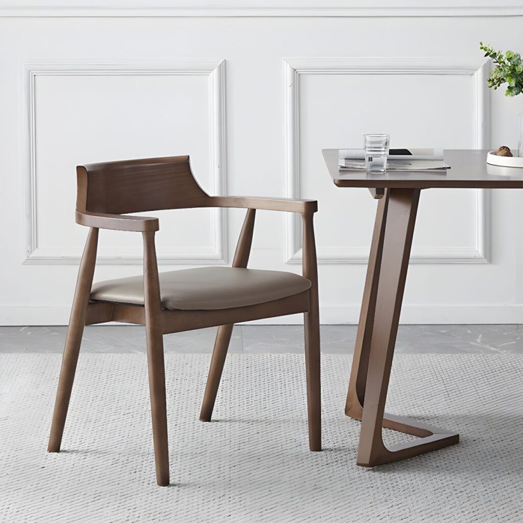 Kursi kayu minimalis modern berbahan kayu solid dengan dudukan fabric empuk dan sandaran ergonomis. Cocok untuk ruang makan, kafe, restoran, maupun ruang kerja bergaya Scandinavian.